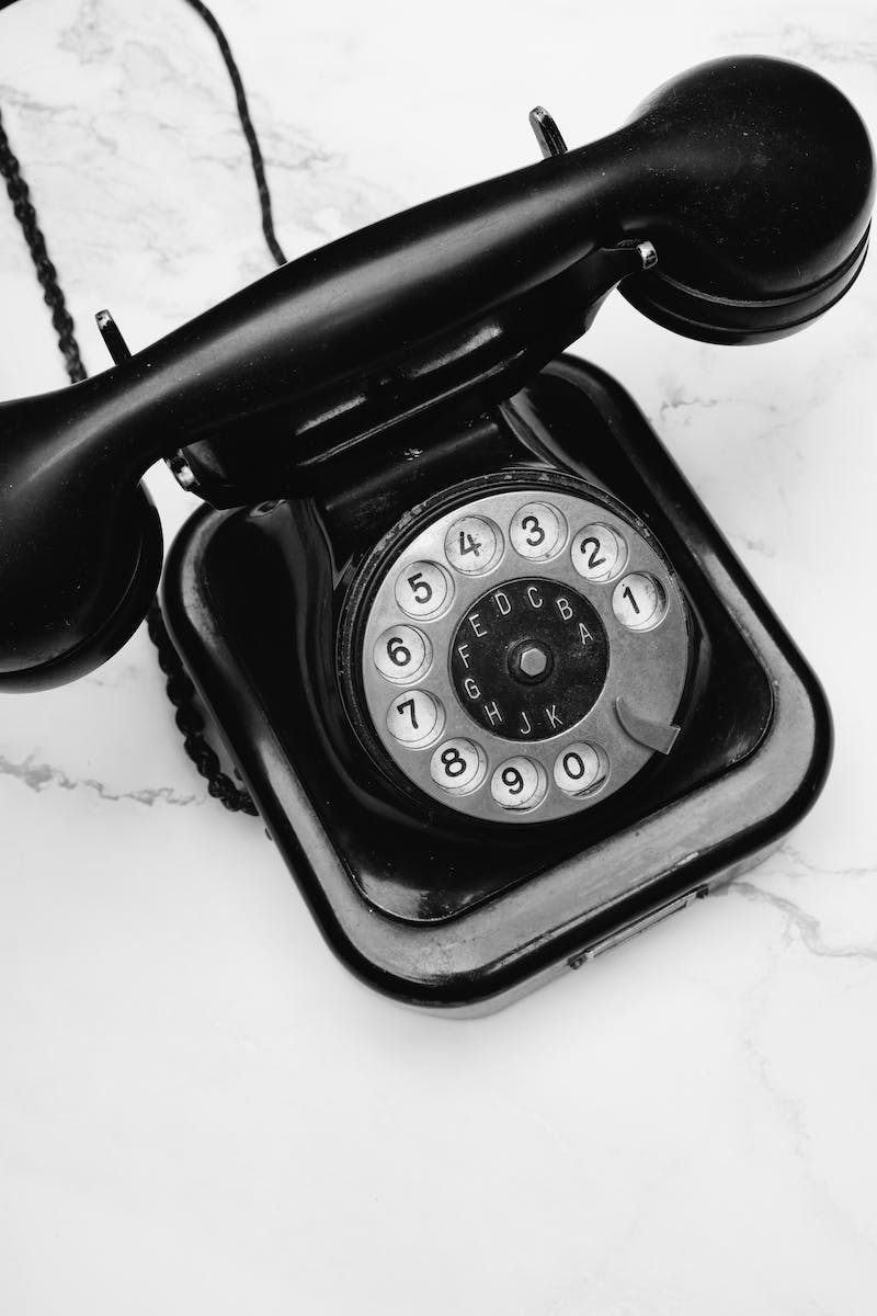 Grayscale Photo of a Rotary Phone