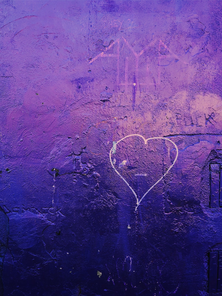 a purple wall with a heart drawn on it