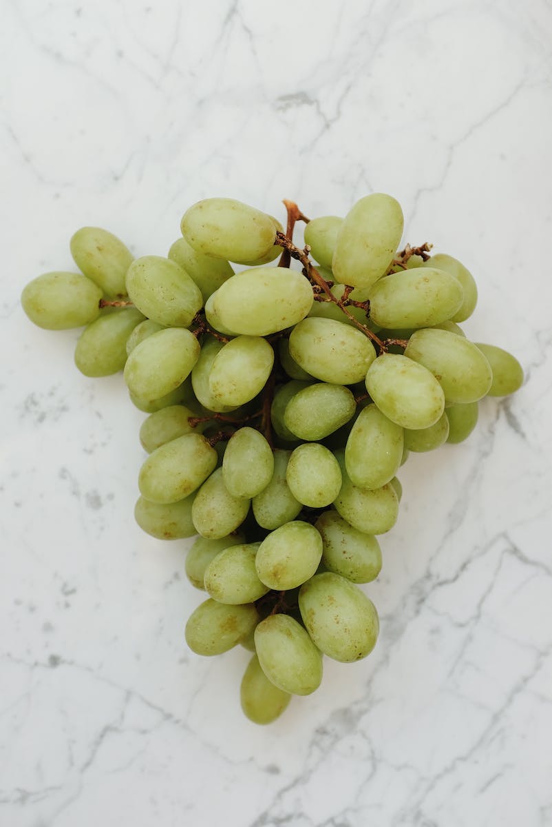 Green Grapes on Marble Table