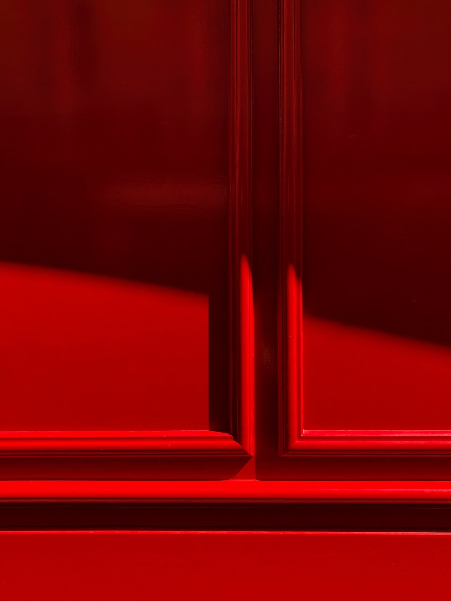a close up of a red door frame