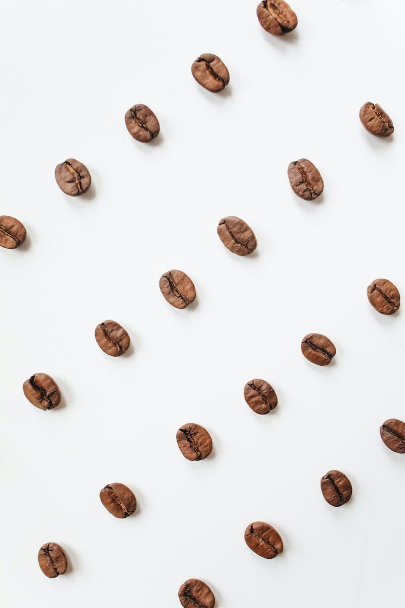 Brown Coffee Beans On White Surface