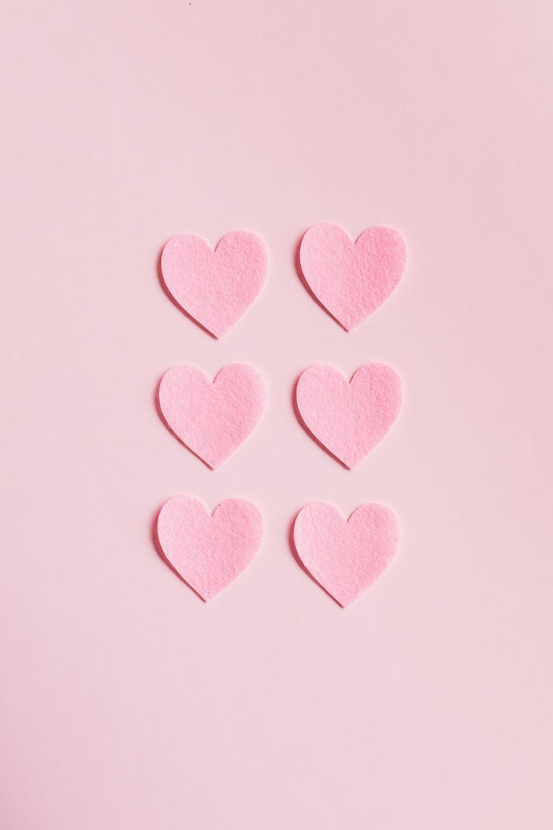 Heart Shaped Cutouts on Pink Background