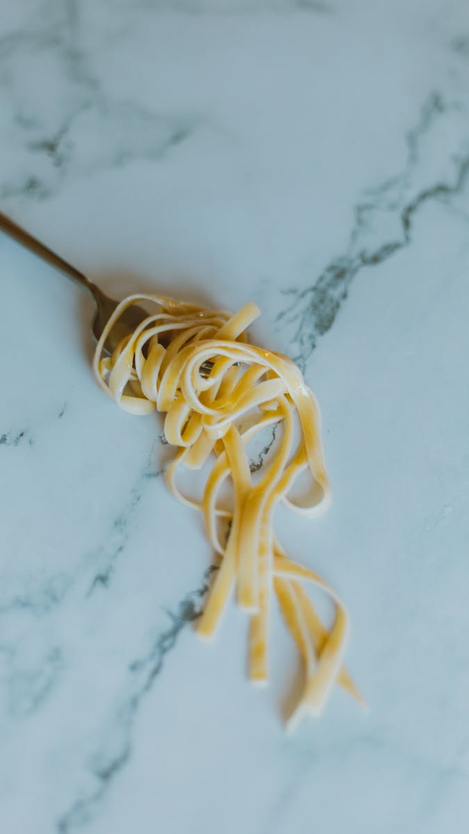 Fork with Pasta on a Marble Top