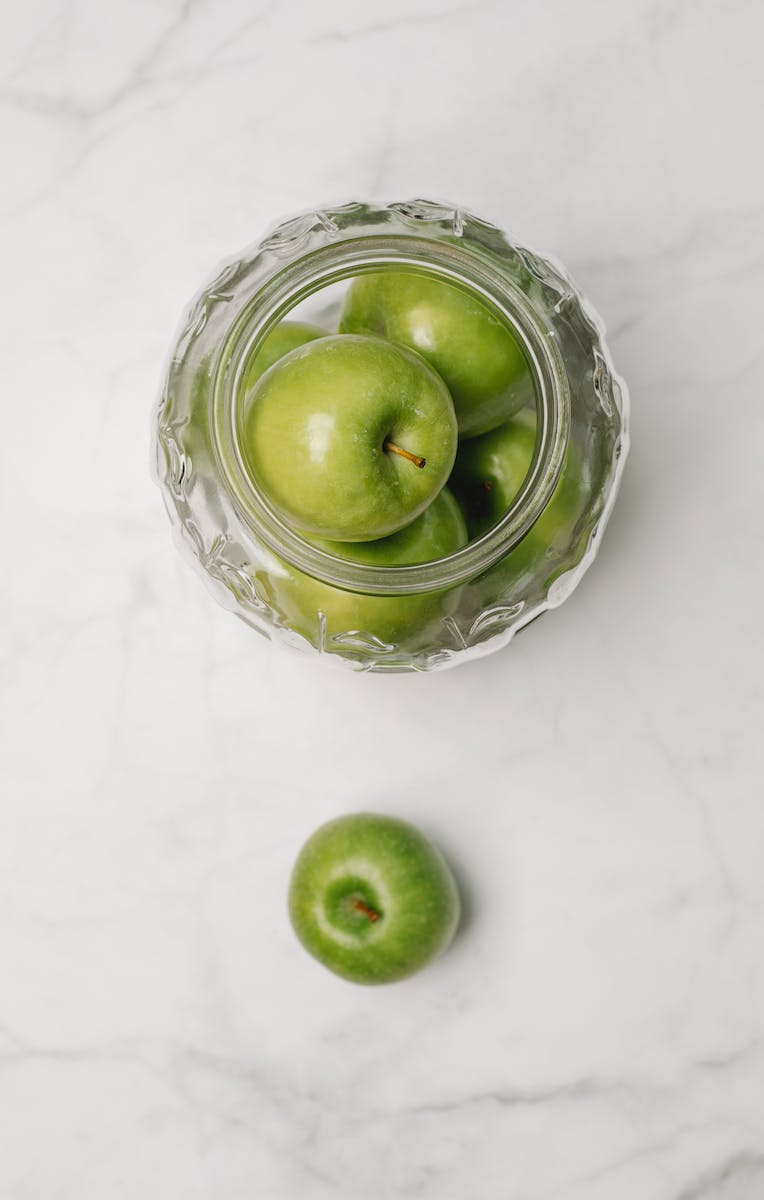 Green apples on marble table
