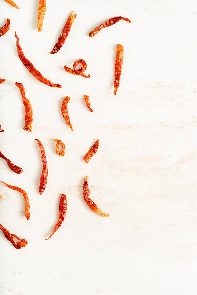 Red Dried Chili Peppers on Marble Surface