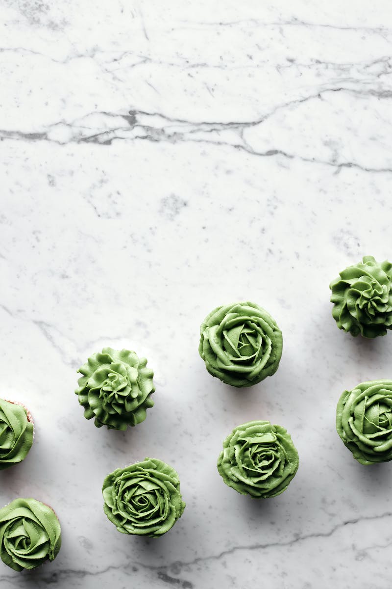 Green Flower Shape Pistachio Cakes on Marble