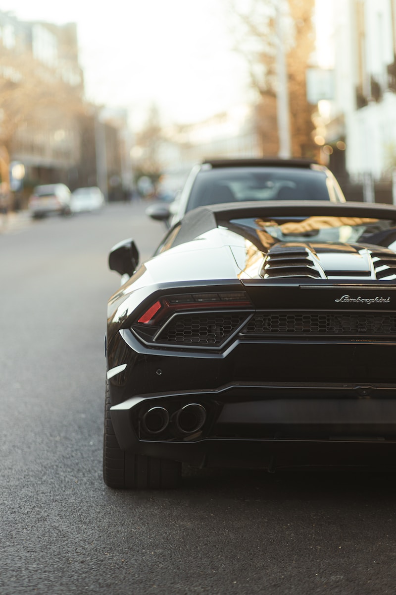 a black sports car parked on the side of the road