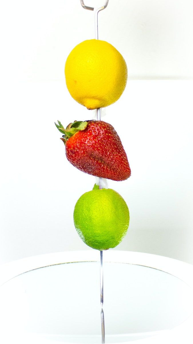 red strawberry and yellow lemon fruit