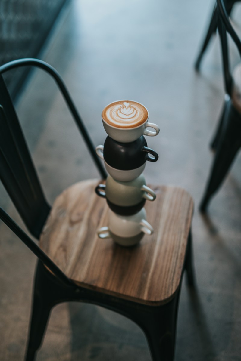 shallow focus photography of coffee cups