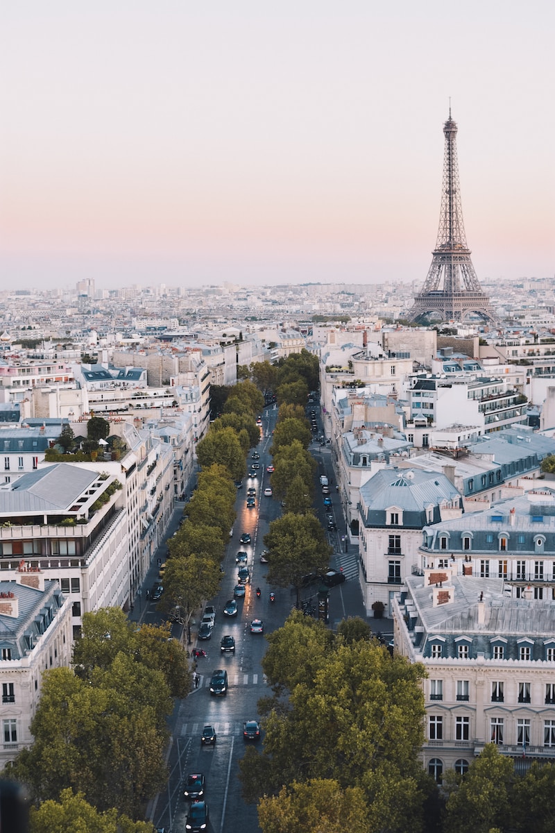 busy street near Eiffel Tower in Paris during daytime