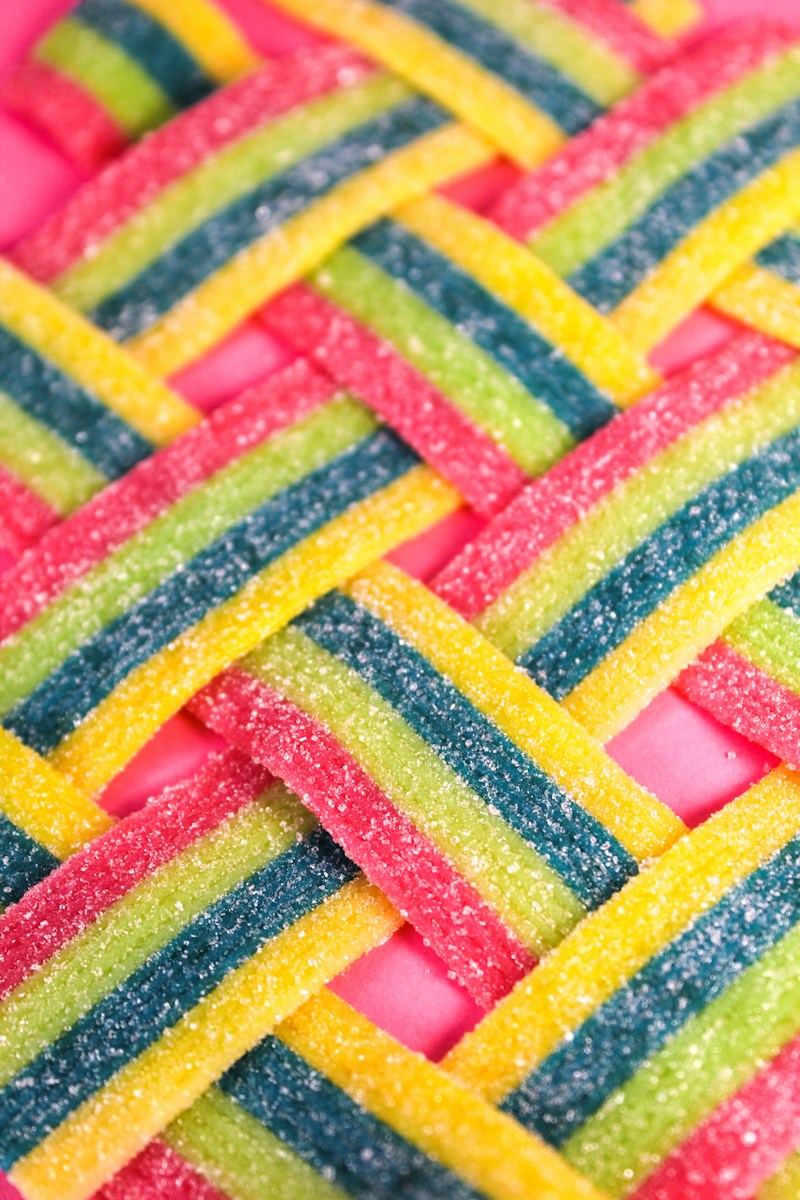 a close up of a rainbow colored candy