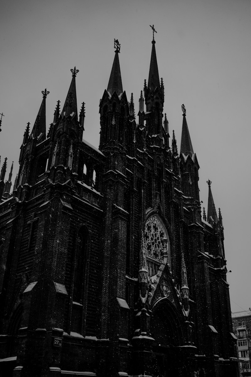 a black and white photo of a gothic church