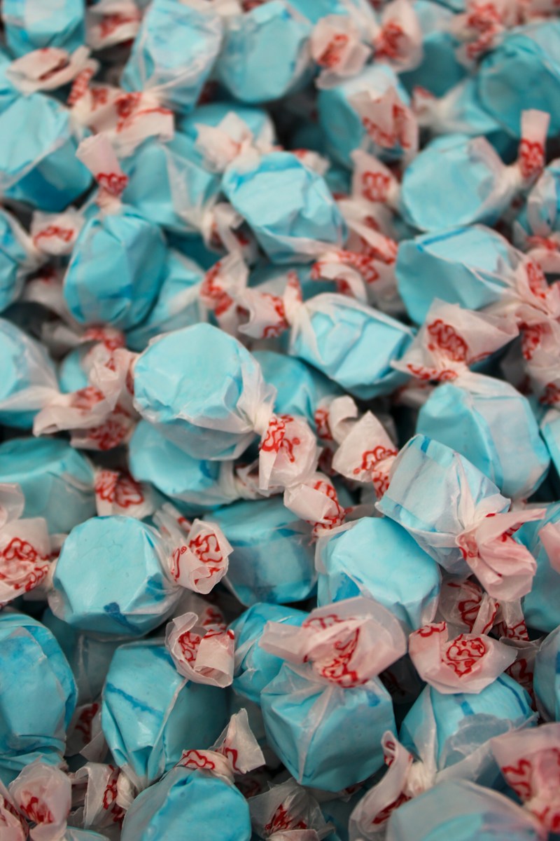 a pile of blue and white candies on top of each other