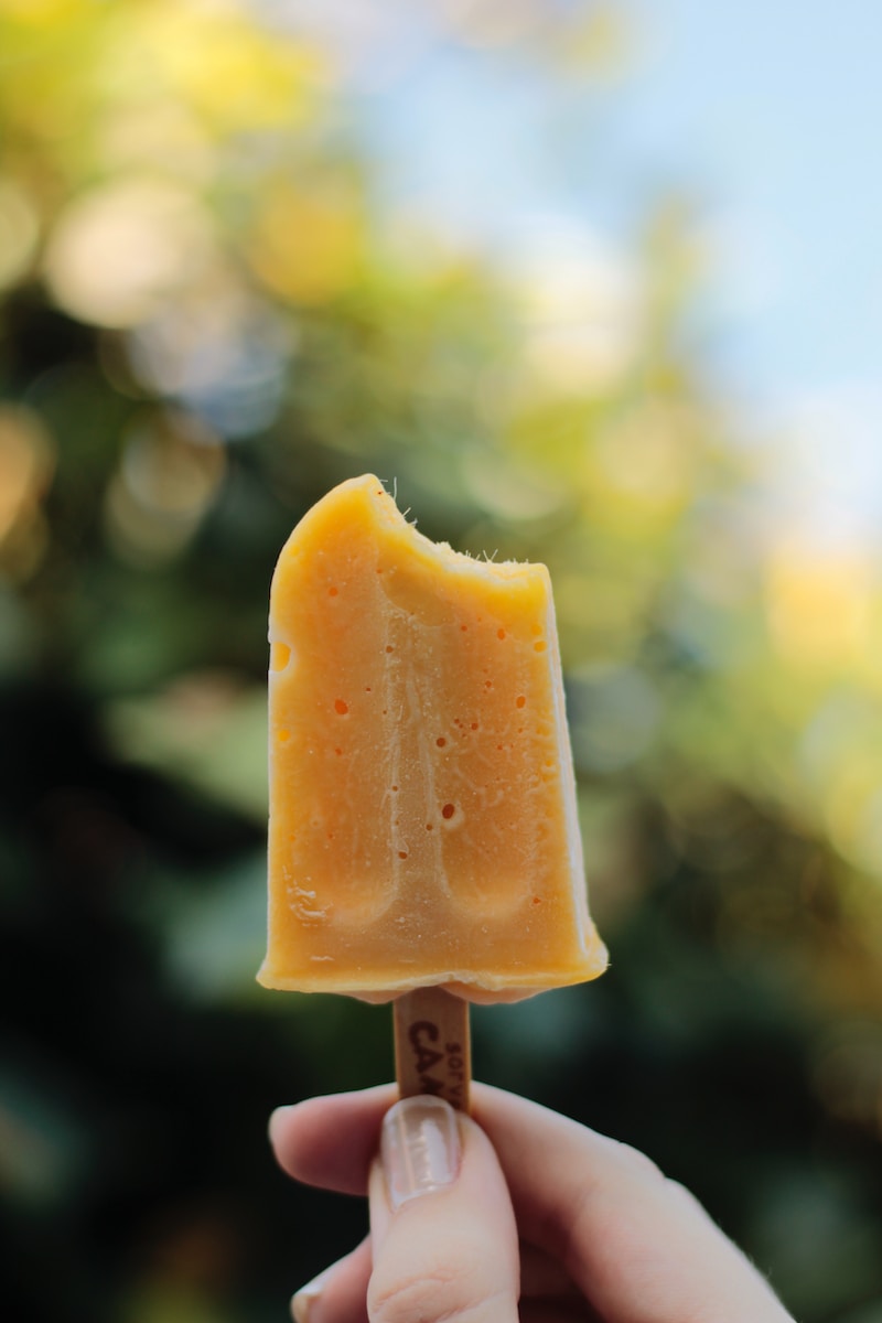 yellow ice cream in stick