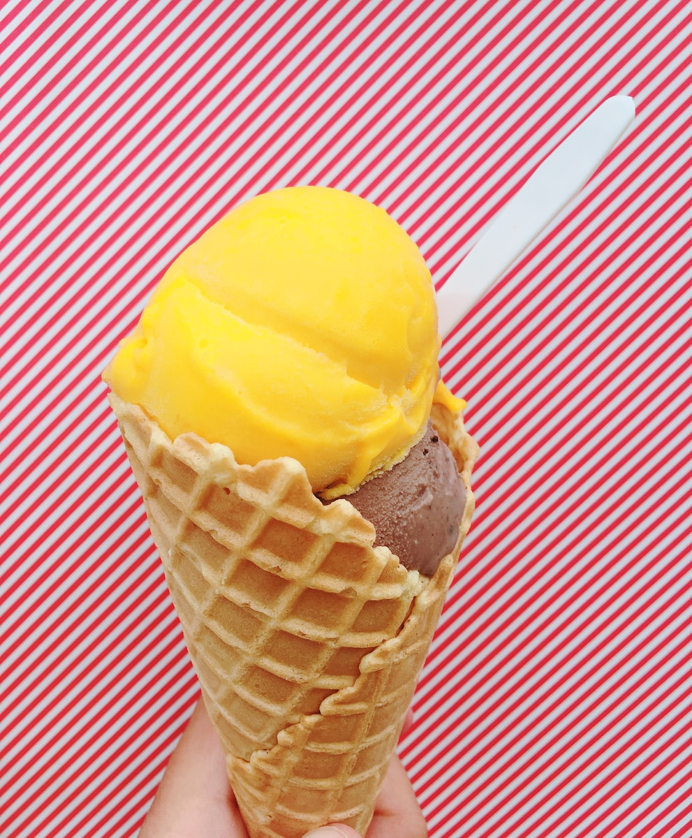 yellow ice cream on cone