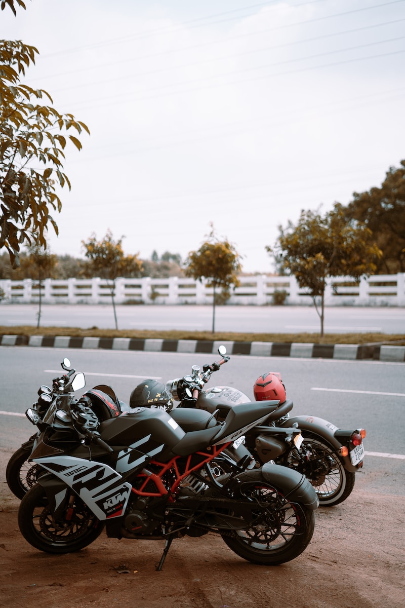 a couple of motorcycles parked on the side of the road
