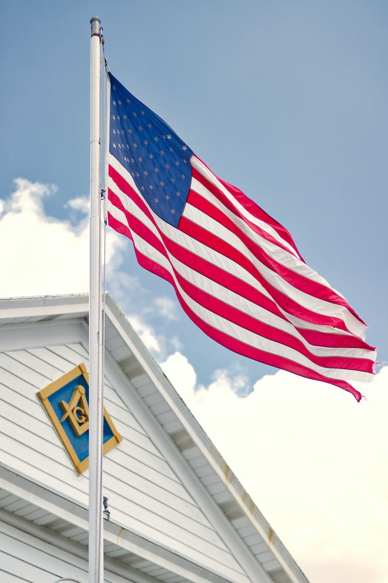 U.s.a. Flag Mounted on White Steel Pole