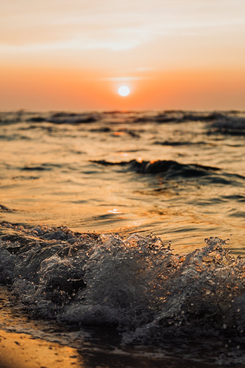Water Waves on Shore during Sunset