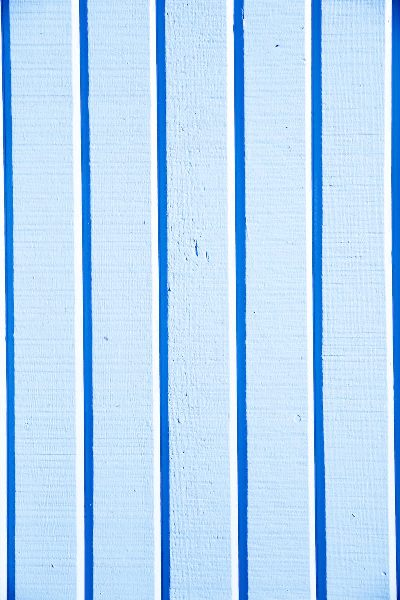 Blue and White Vertical Lines on Light Blue Surface