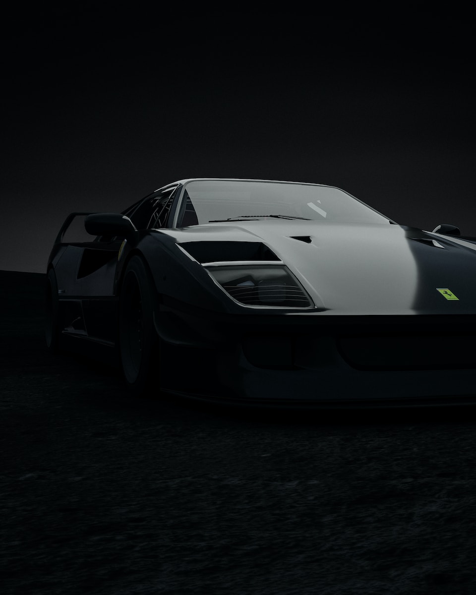 a black and white sports car in the dark