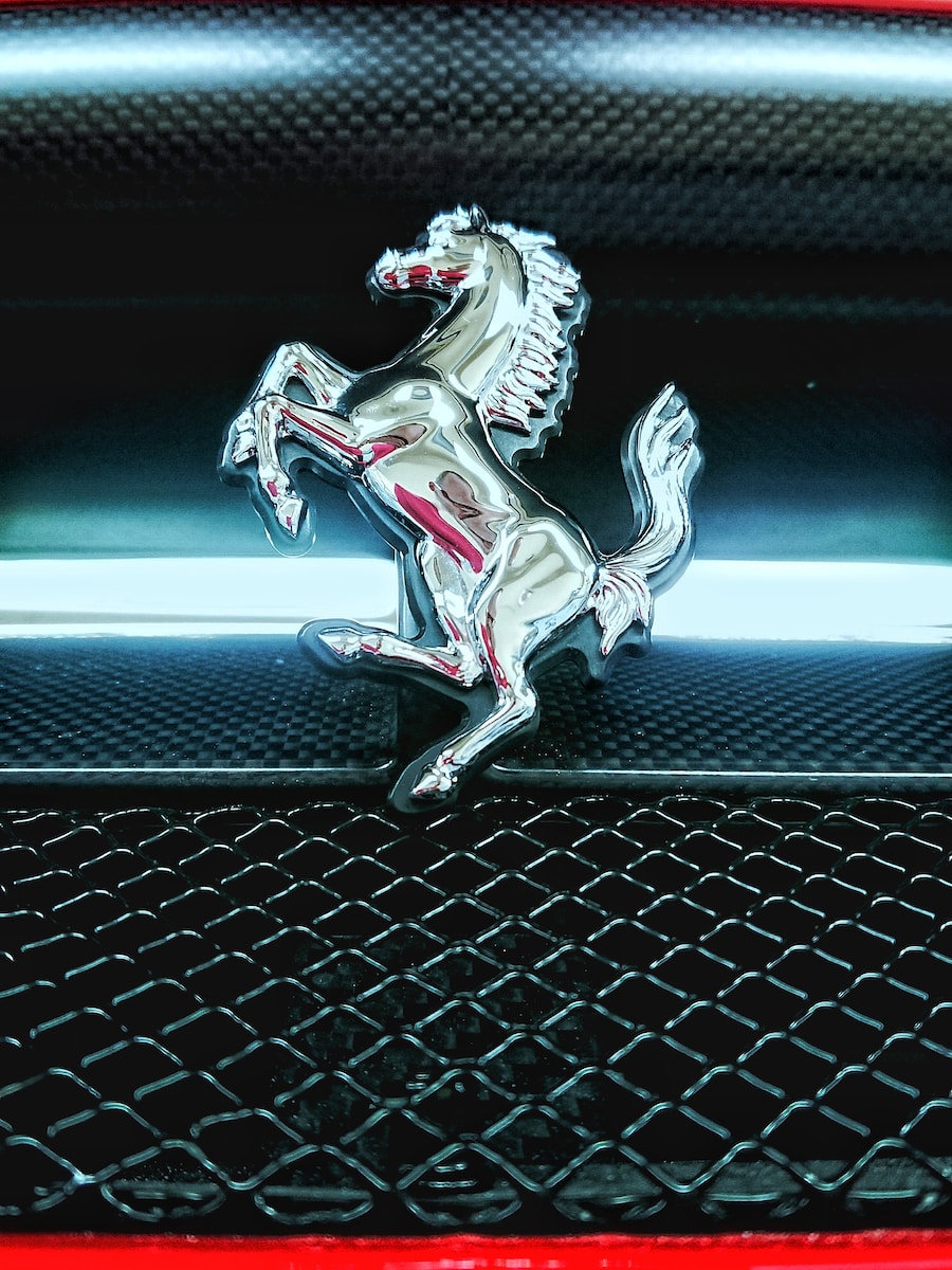 silver horse figurine on black metal frame