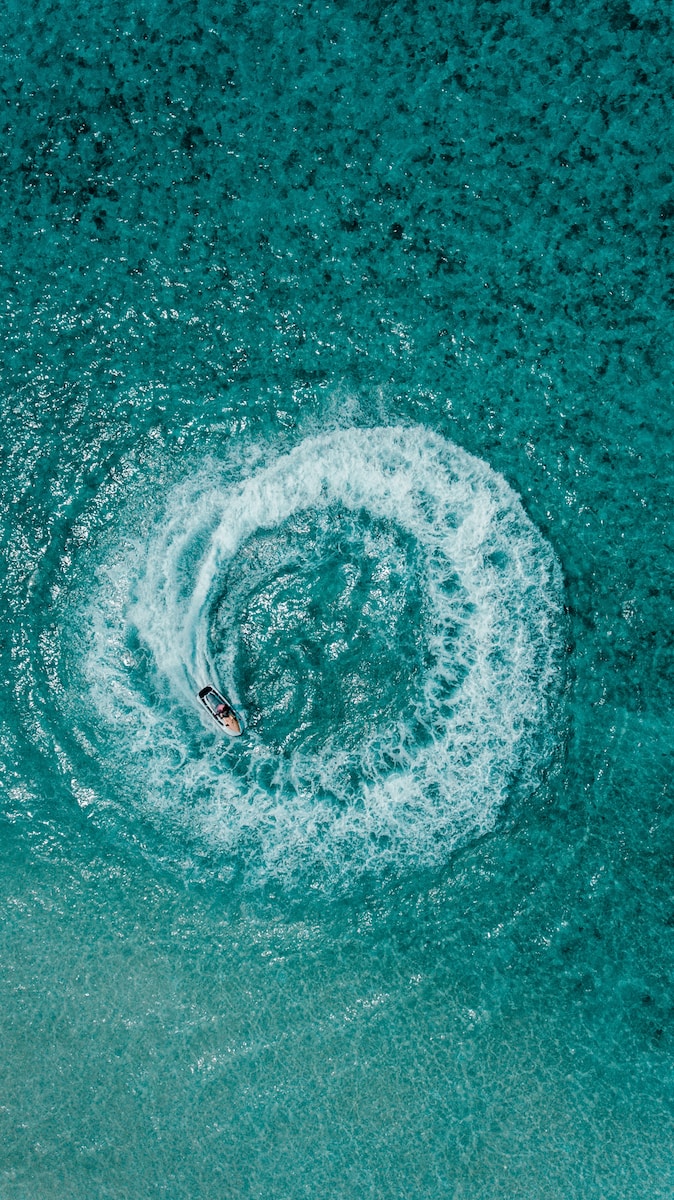 aerial shot person riding on personal watercraft
