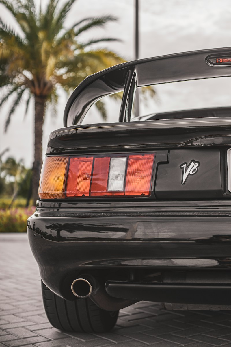 the rear end of a black sports car