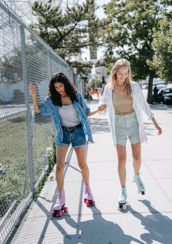 Beautiful Teenage Girls Roller Skating on the Street